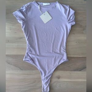 NEW WITH TAGS/Meshki Haven Bodysuit in Lilac/ Size: Small